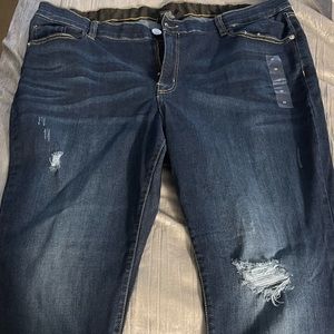 Lane Bryant size 22 dark blue jeans with a few rips.